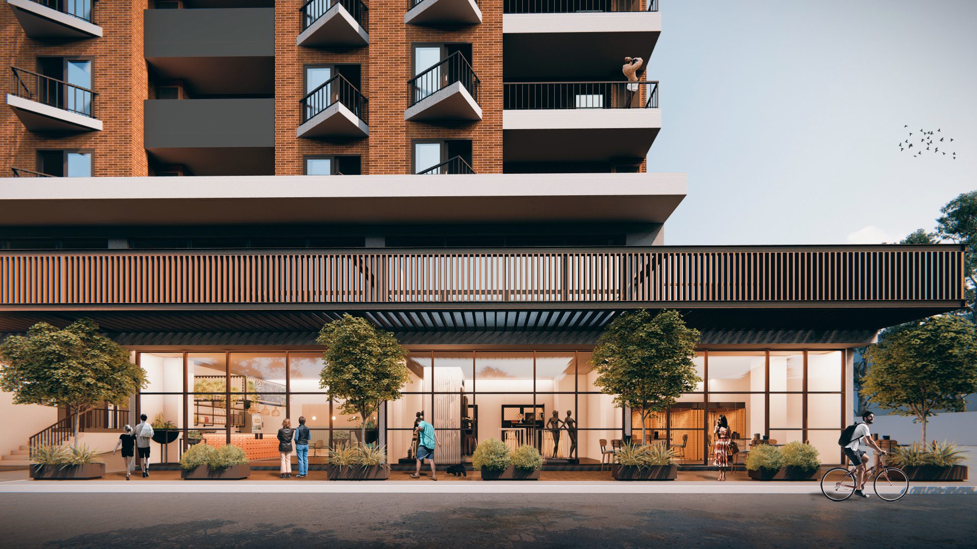 Render nocturno de la planta baja comercial de InHaus iluminada