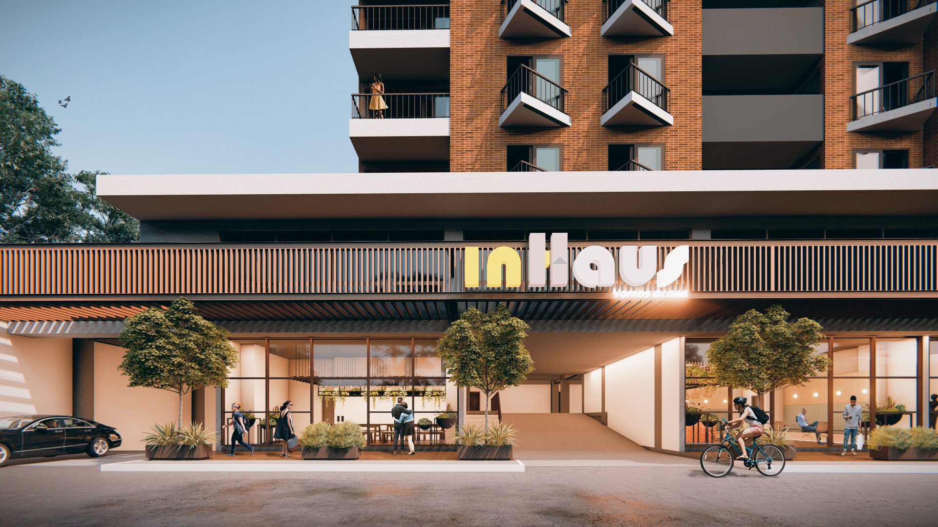 Render de la planta baja comercial de InHaus con locales iluminados y peatones